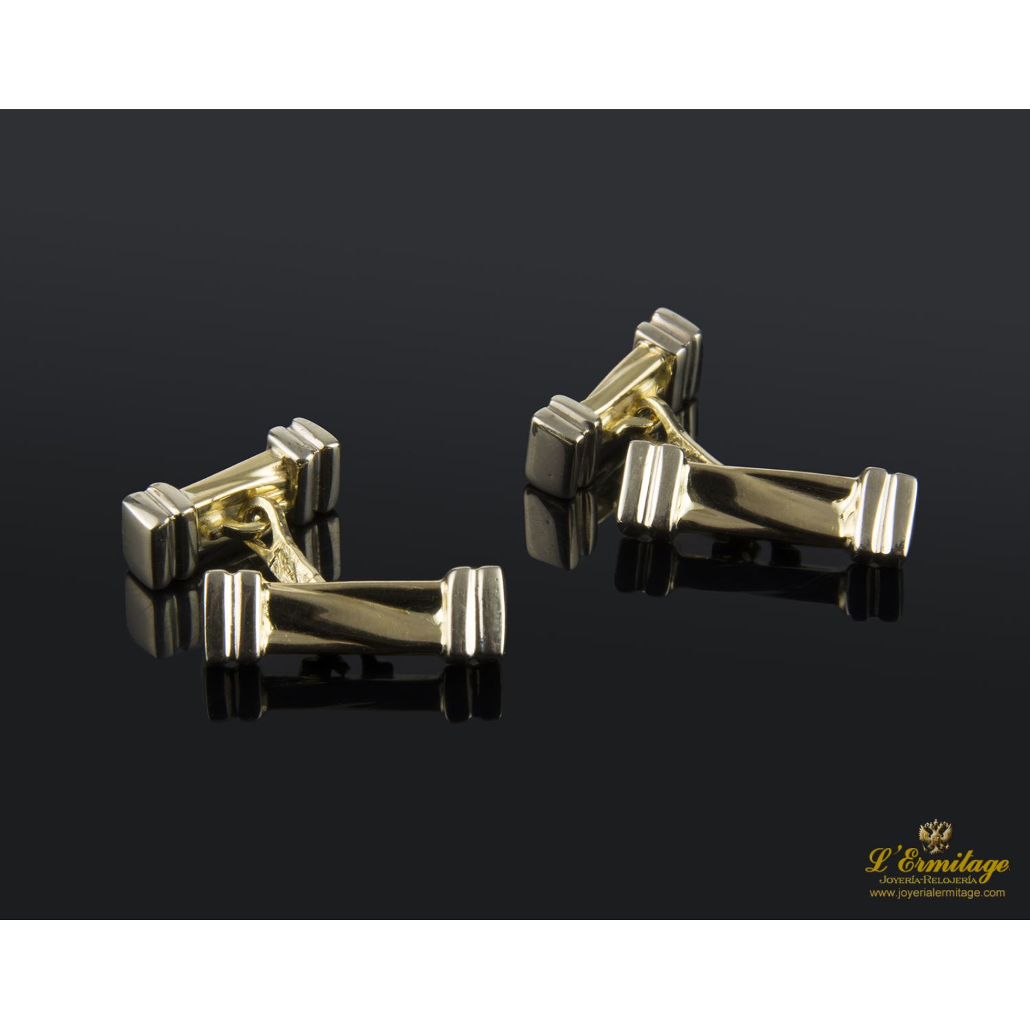 Gemelos en forma de barras realizados en oro amarillo y oro blanco.