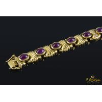 Pulsera realizada en oro amarillo con rubíes y brillantes.