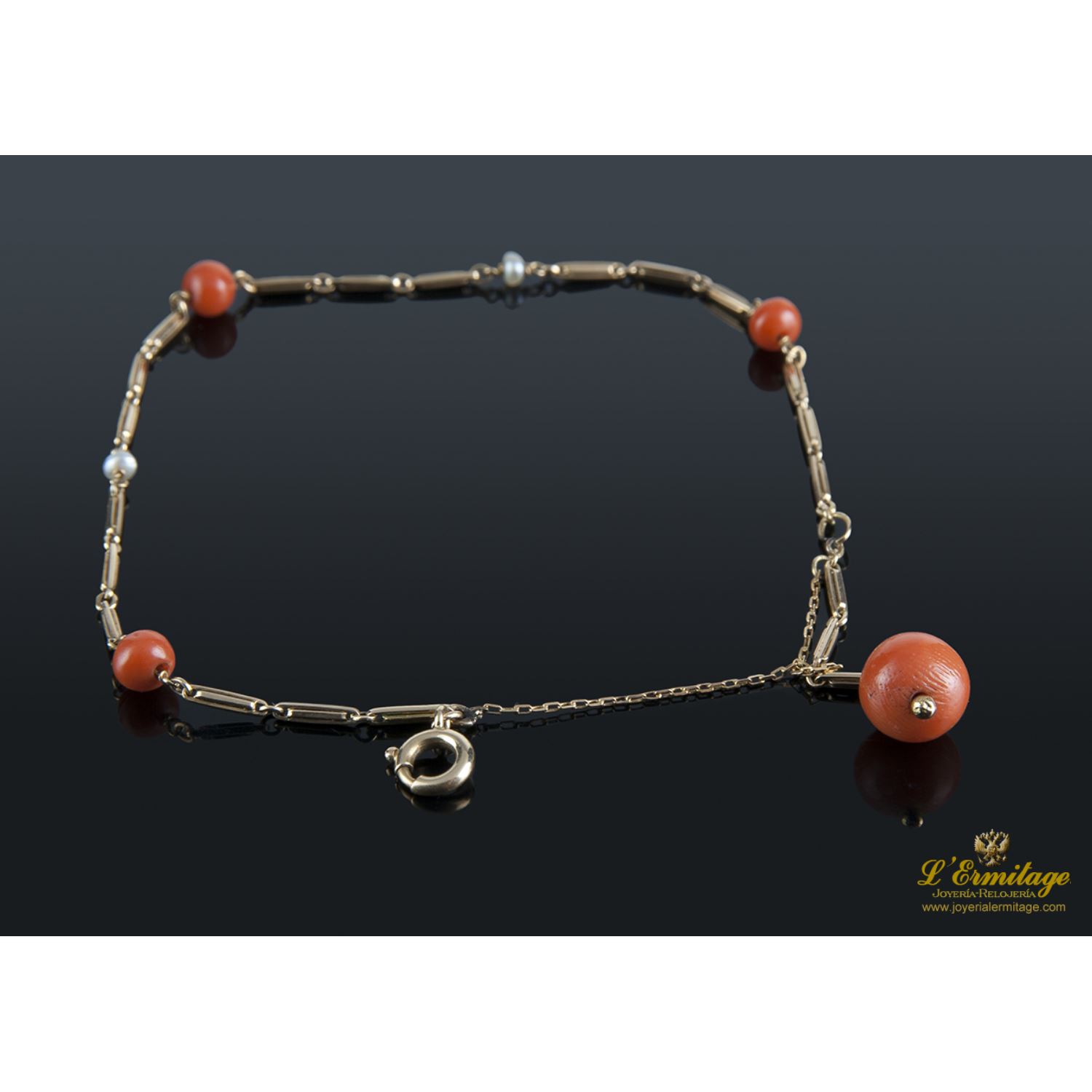 Pulsera oro amarillo y coral