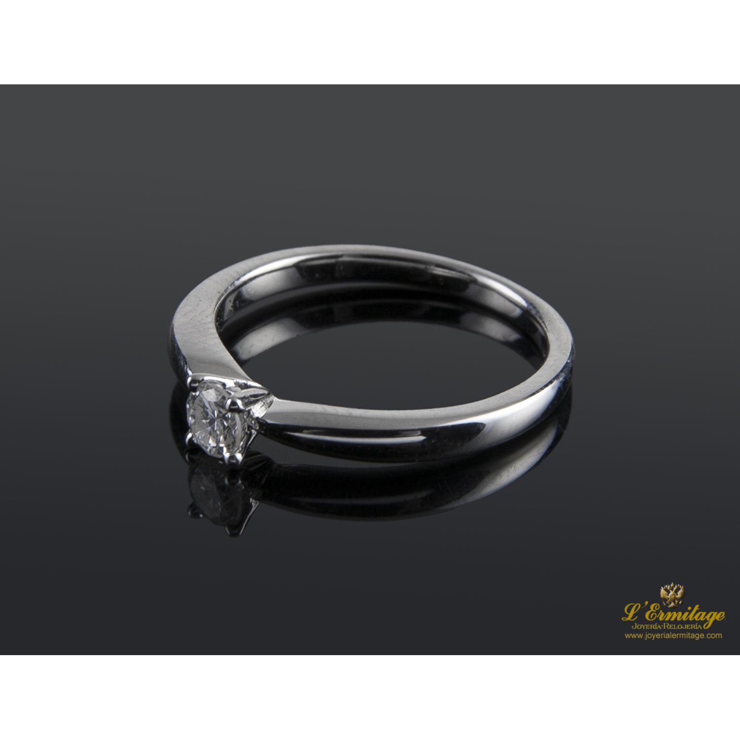Sortija solitario oro blanco color g, pureza si1 y peso 0,20 cts.