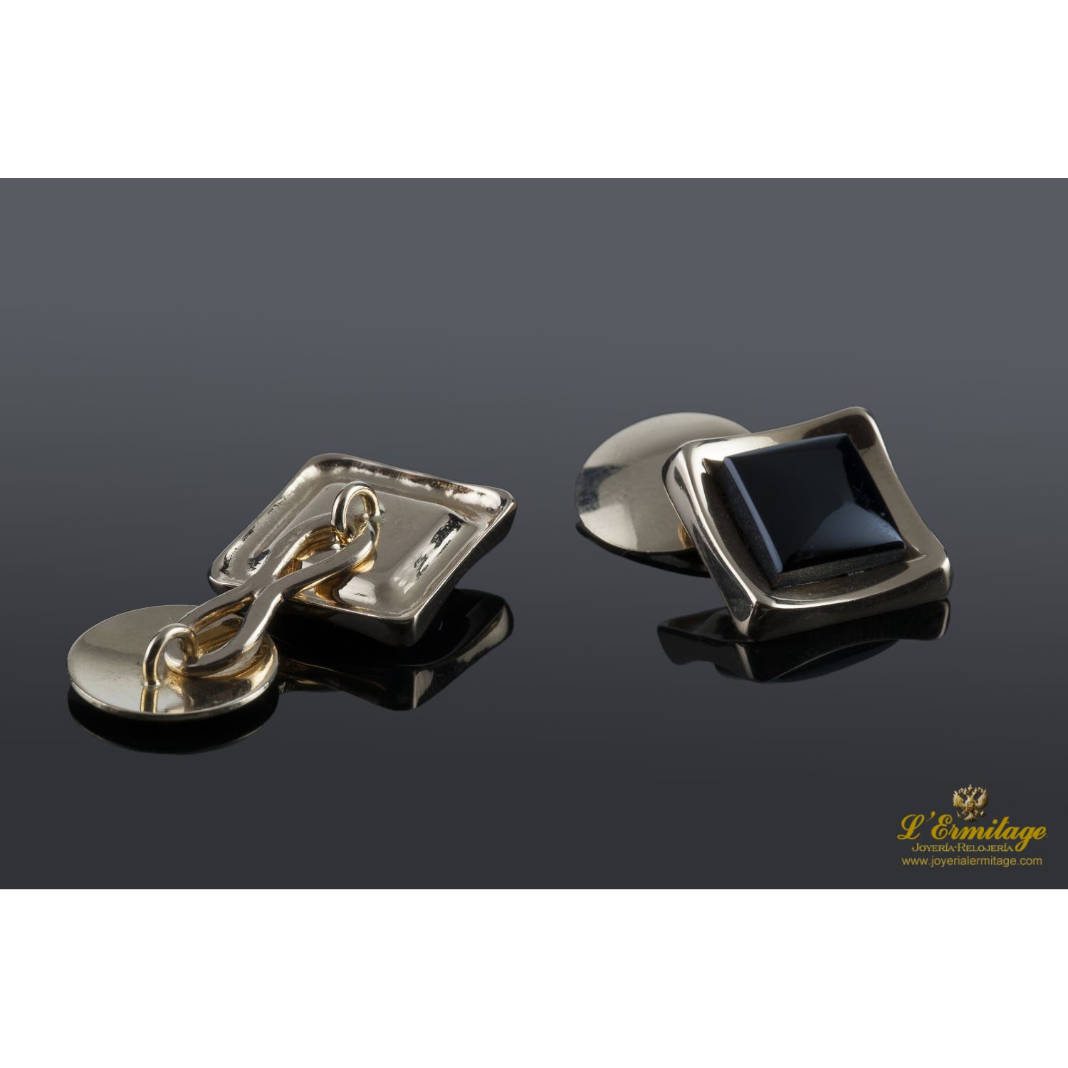 Gemelos realizados en oro amarillo y motivos con onix