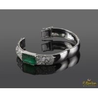Pulsera rígida en oro blanco con esmeralda y diamantes.