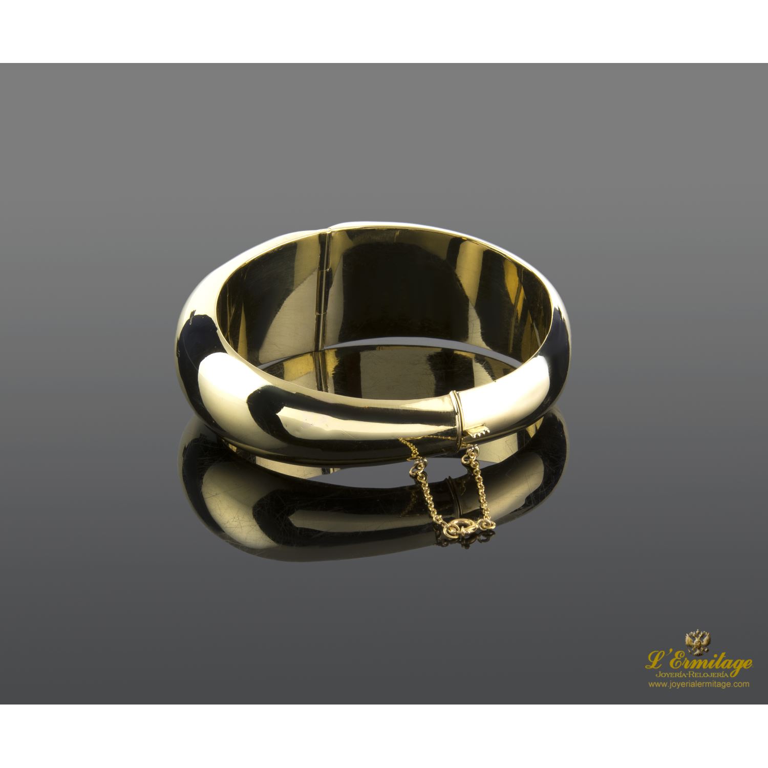 Pulsera oro amarillo media caña con malaquita.