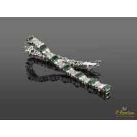 Pulsera en oro blanco con esmeraldas y brillantes.