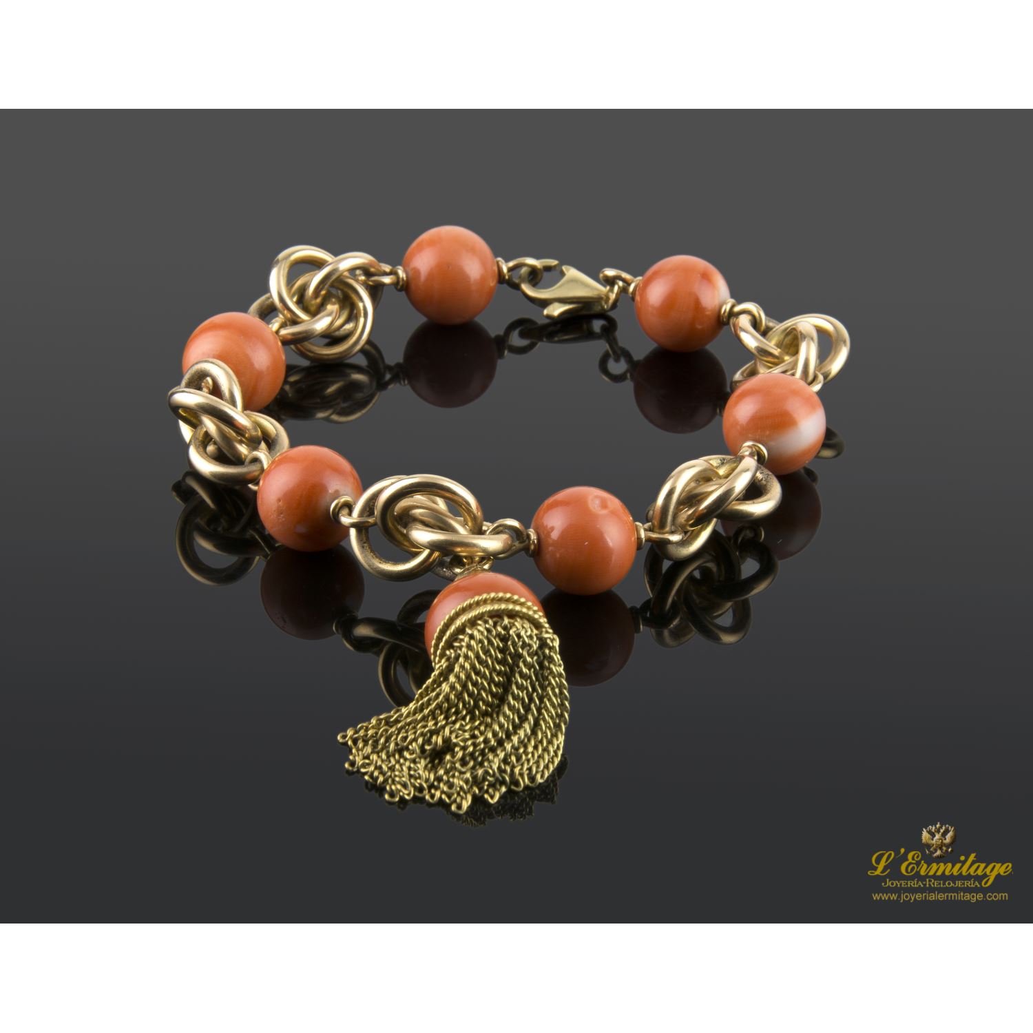Pulsera en oro amarillo con bolas de coral