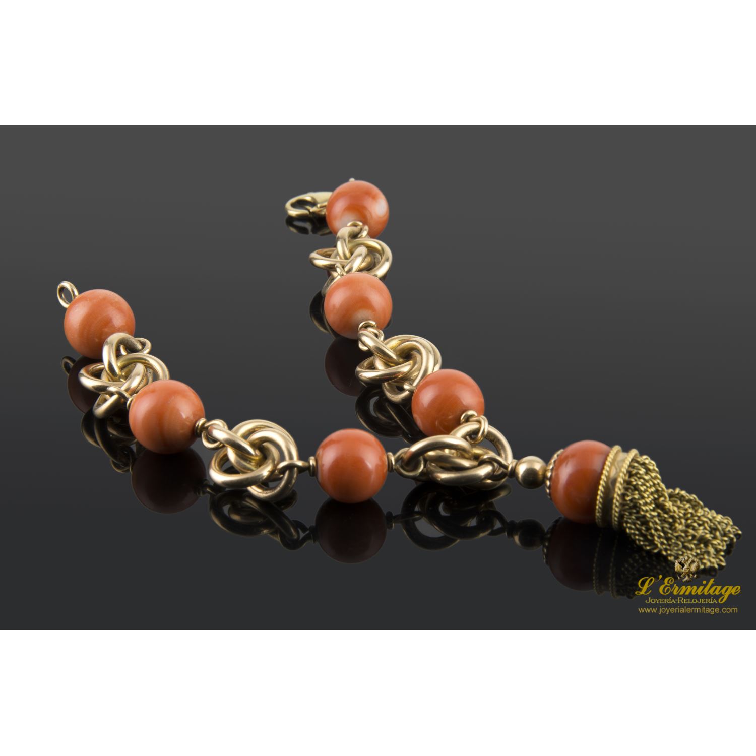 Pulsera en oro amarillo con bolas de coral