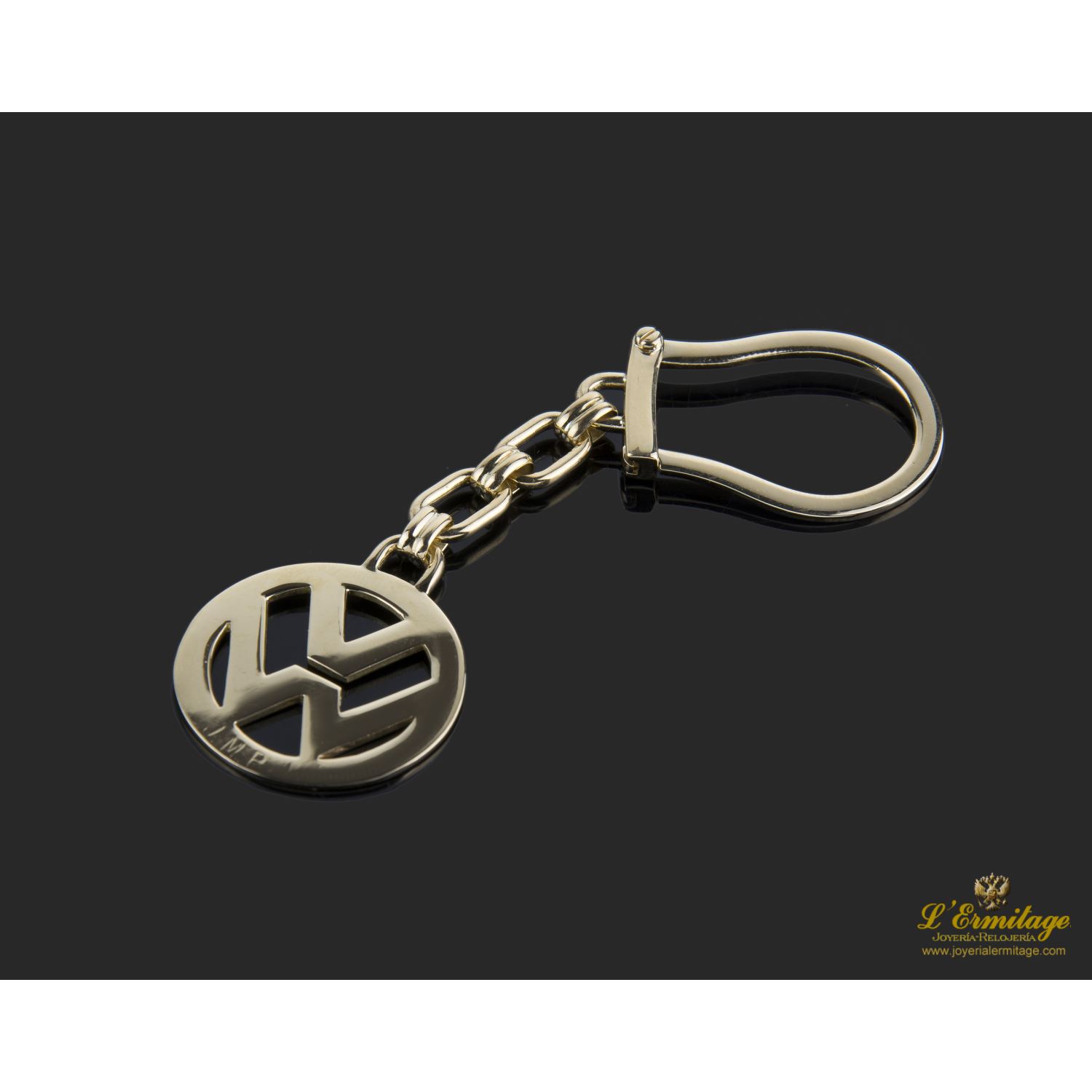 Llavero volkswagen reliazado en oro amarillo.