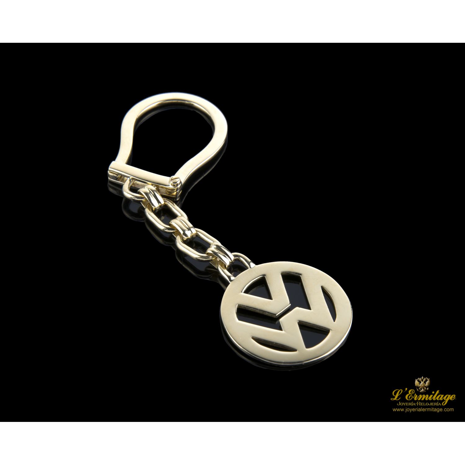 Llavero volkswagen reliazado en oro amarillo.