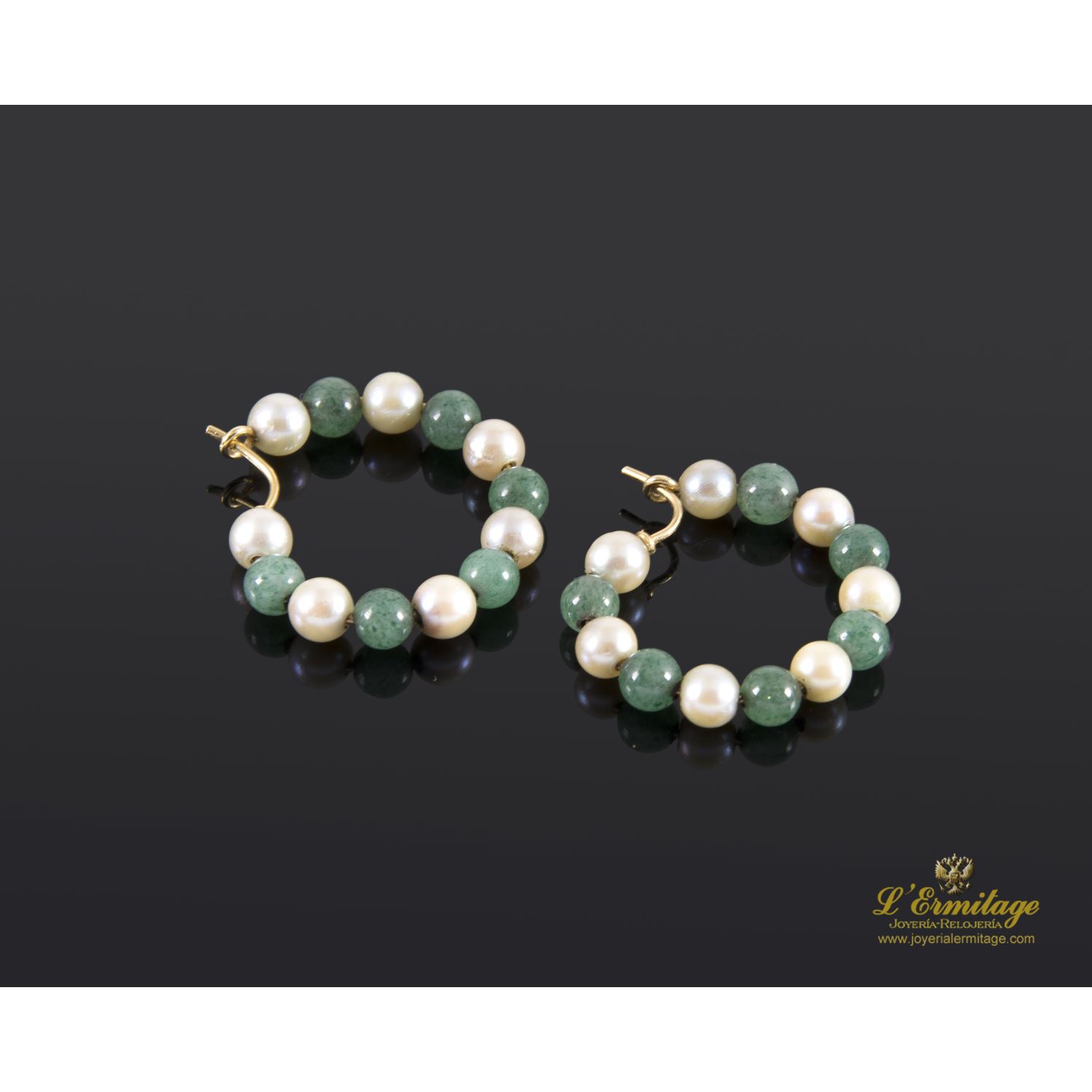 Argollas oro amarillo esmeraldas y perlas.
