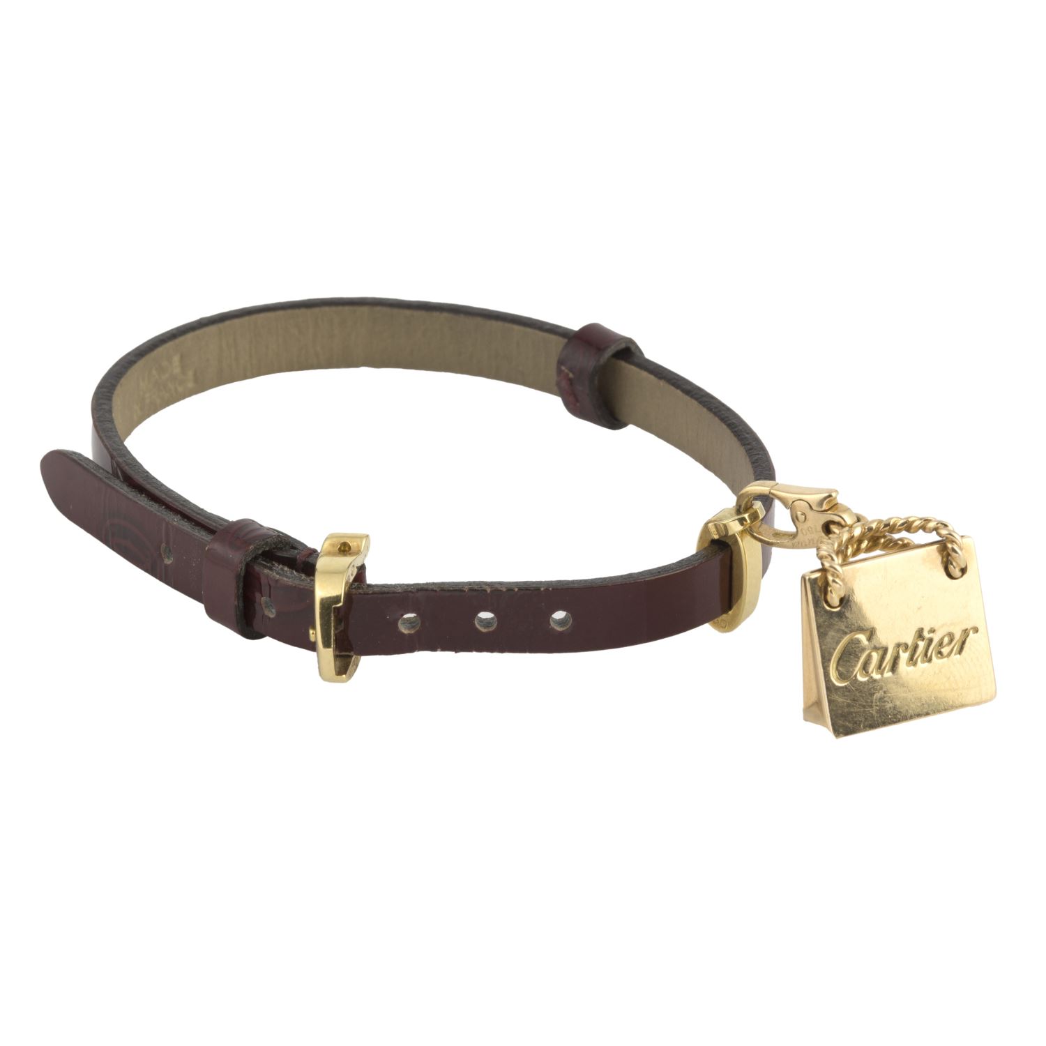 Pulsera cuero cartier con adorno de bolso en oro amarillo