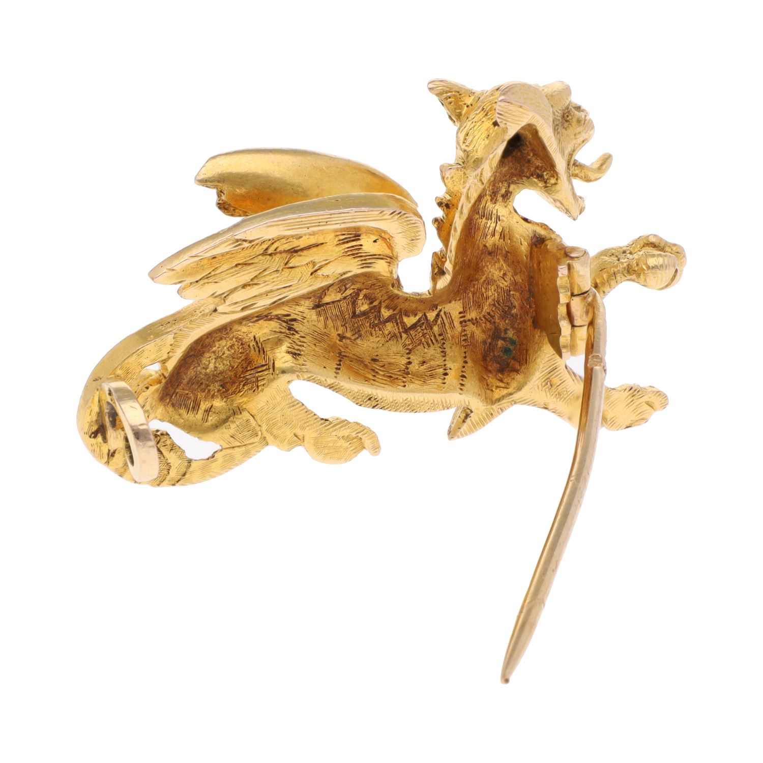 Broche en oro amarillo con forma de grifo animal mitológico.