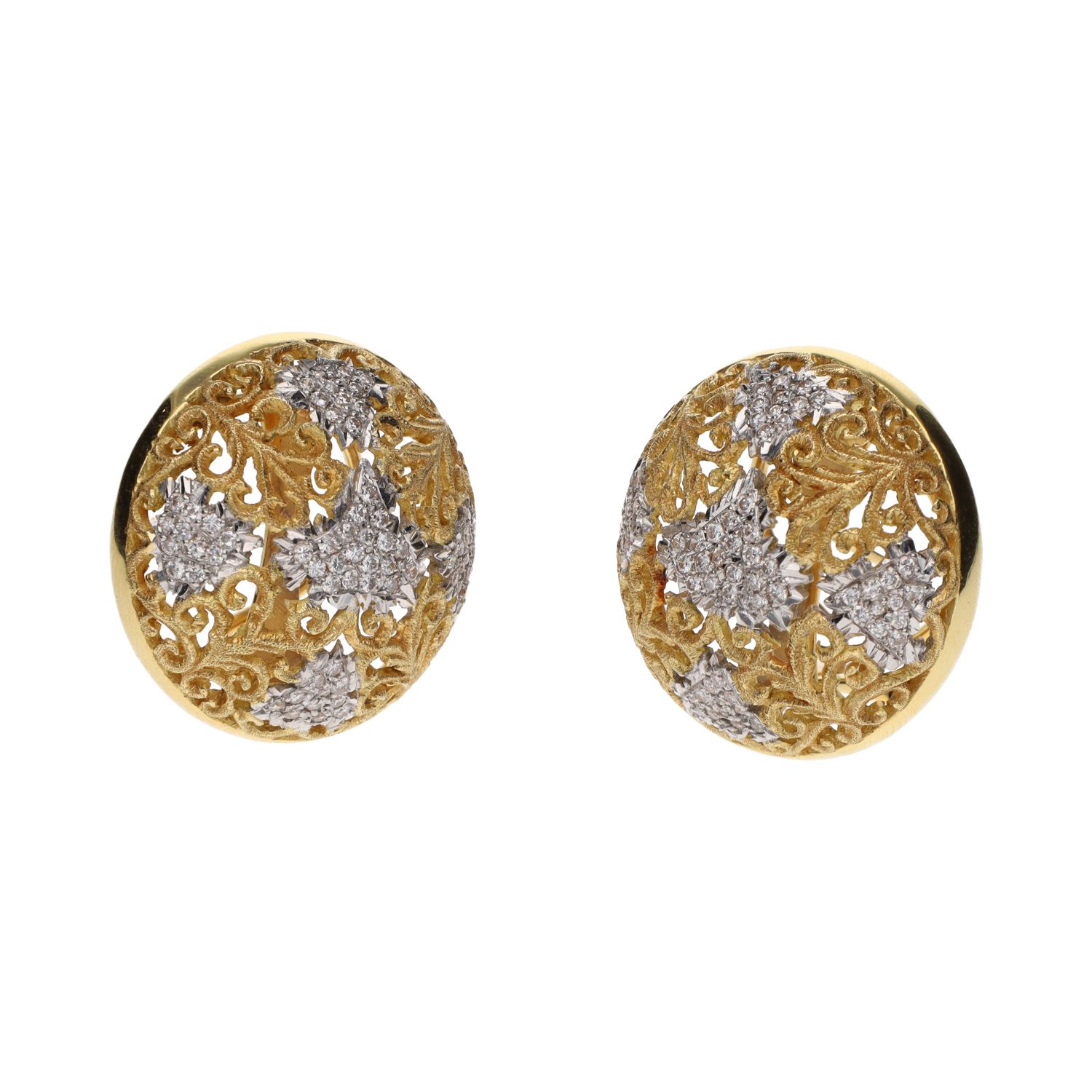 Pendientes firmados por yanes realizados en oro amarillo y oro blanco con brillantes.