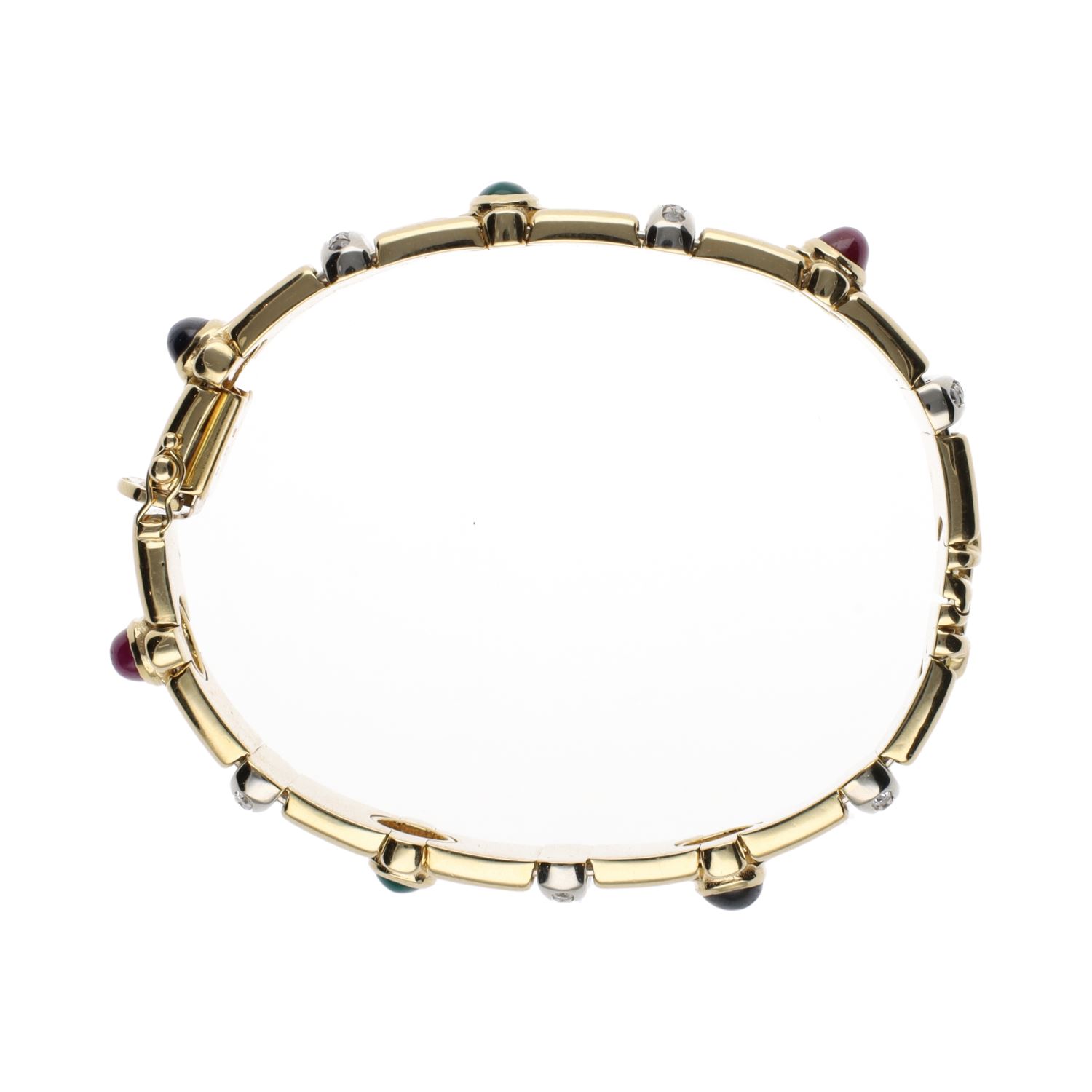 Pulsera rígida en oro amarillo con zafiros, rubíes, esmeraldas y brillantes.