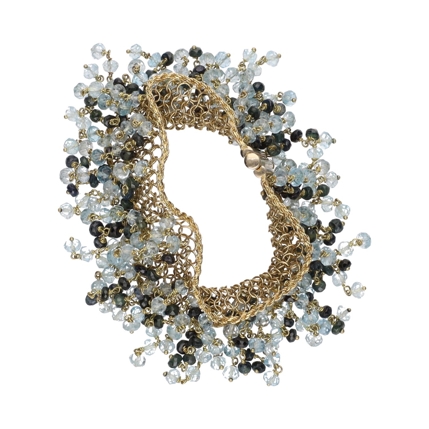 Pulsera en oro amarillo con bolitas de topacios y zafiros.