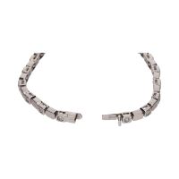 Pulsera tipo riviere en oro blanco con brillantes en chatón.