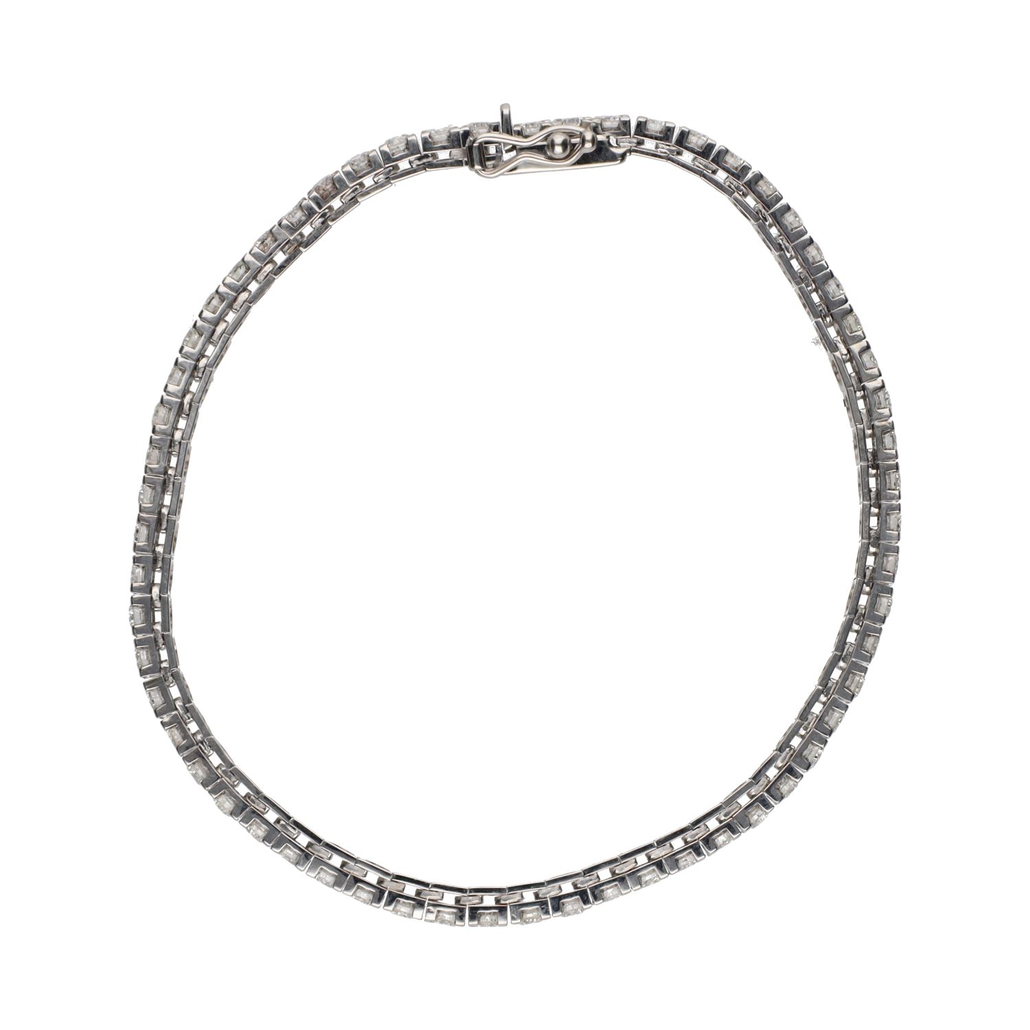 Pulsera riviere en oro blanco con brillantes.