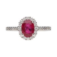 Sortija en oro blanco con rubí central y brillantes en orla y brazos. Talla 14.