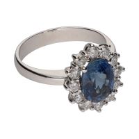 Sortija con zafiro central y brillantes en orla. Talla 14.