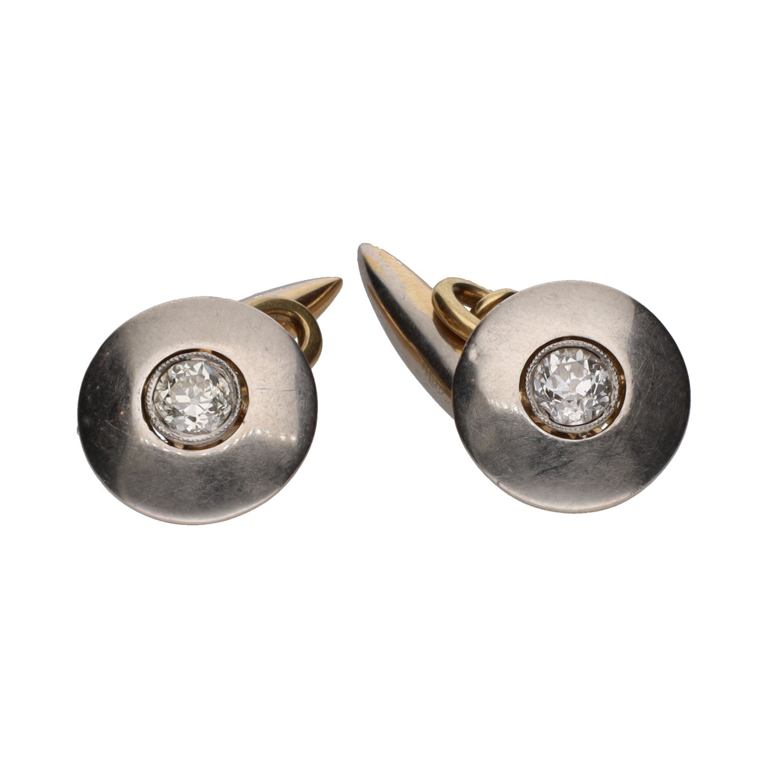 Botonadura en oro blanco y oro amarillo con diamantes.