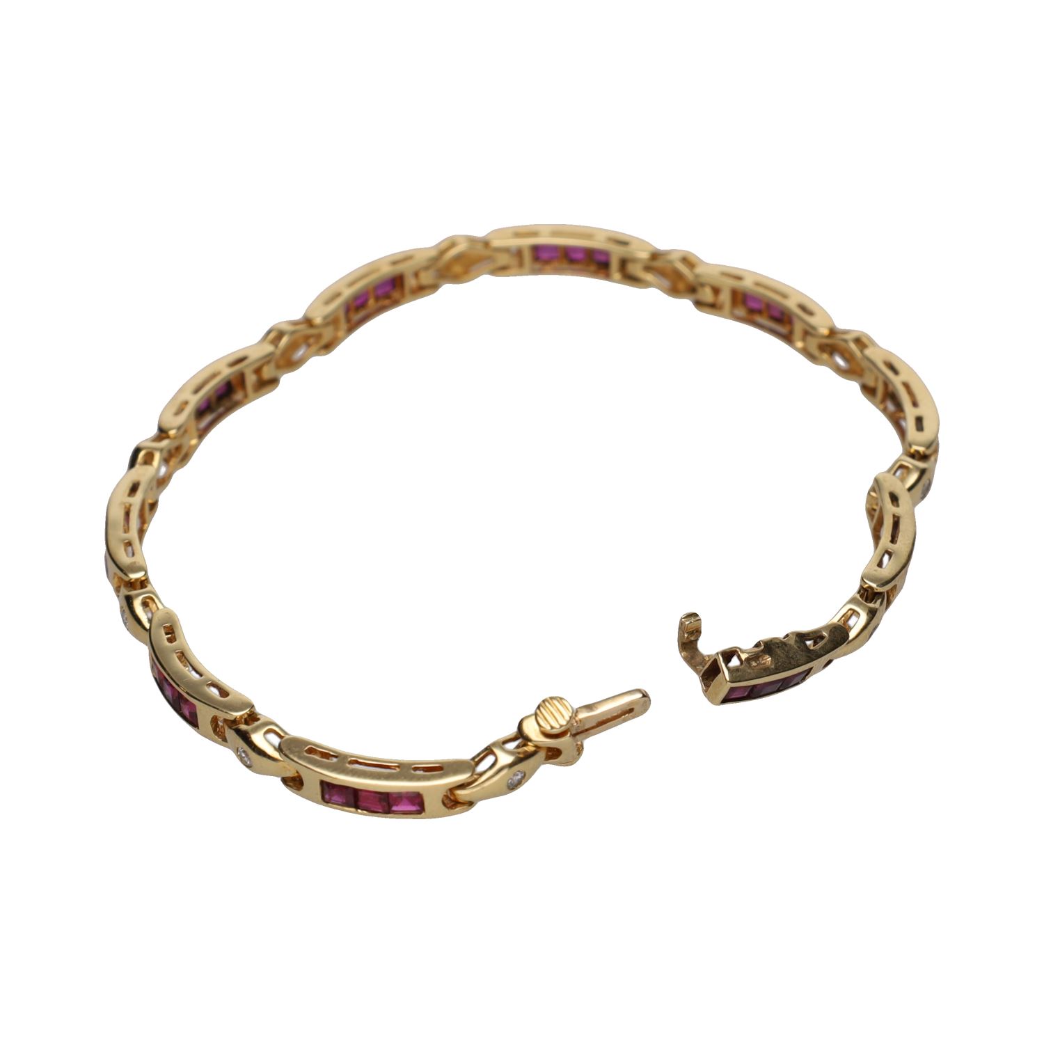 Pulsera en oro amarillo con rubíes y brillantes.