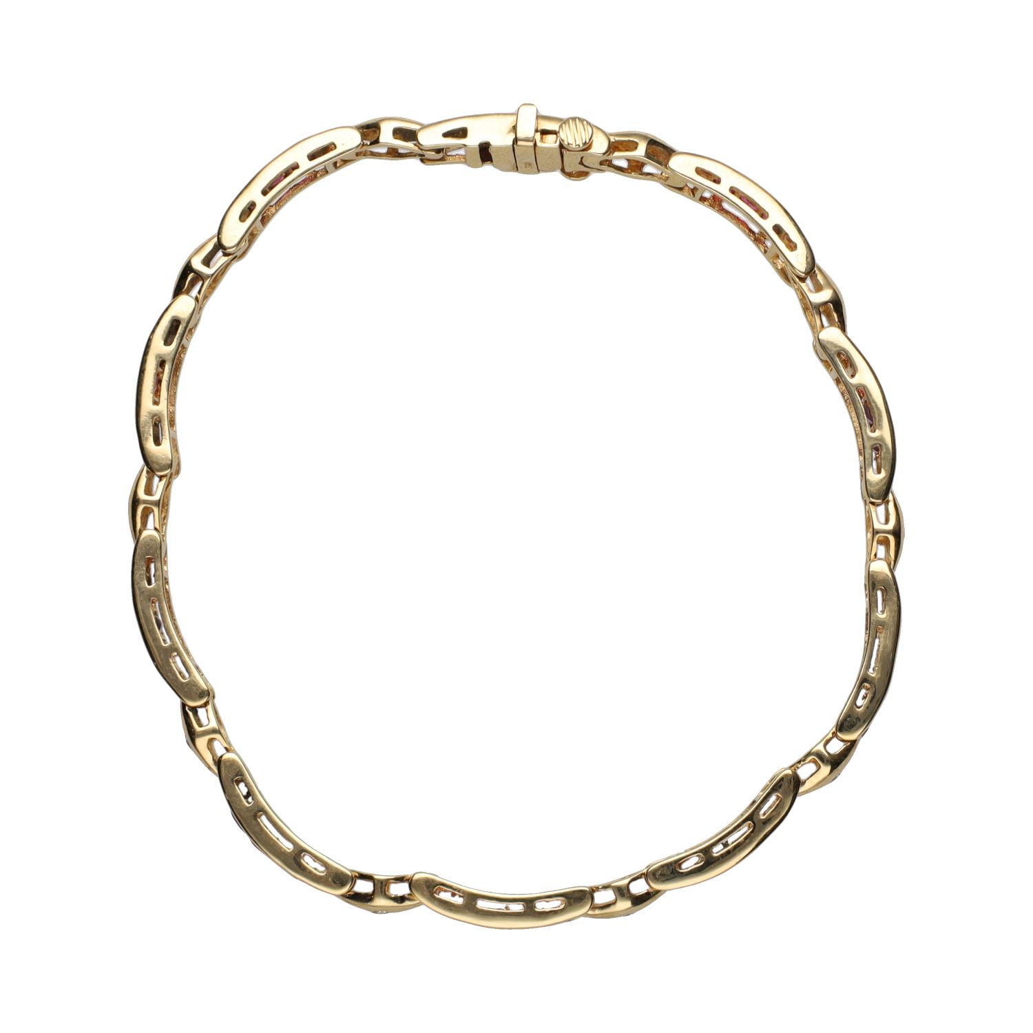Pulsera en oro amarillo con rubíes y brillantes.