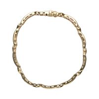 Pulsera en oro amarillo con rubíes y brillantes.