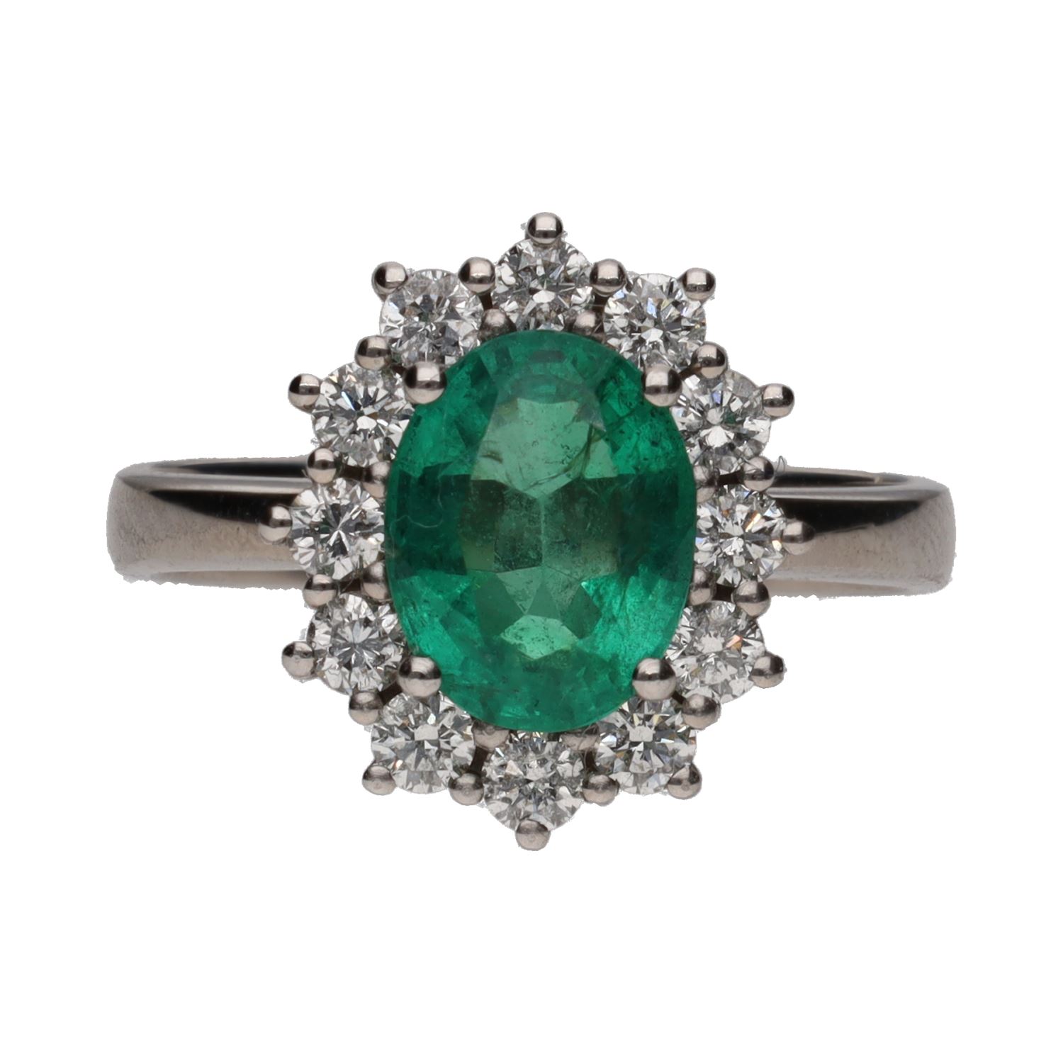 Sortija en oro blanco con esmeralda y orla de brillantes. Talla 15.