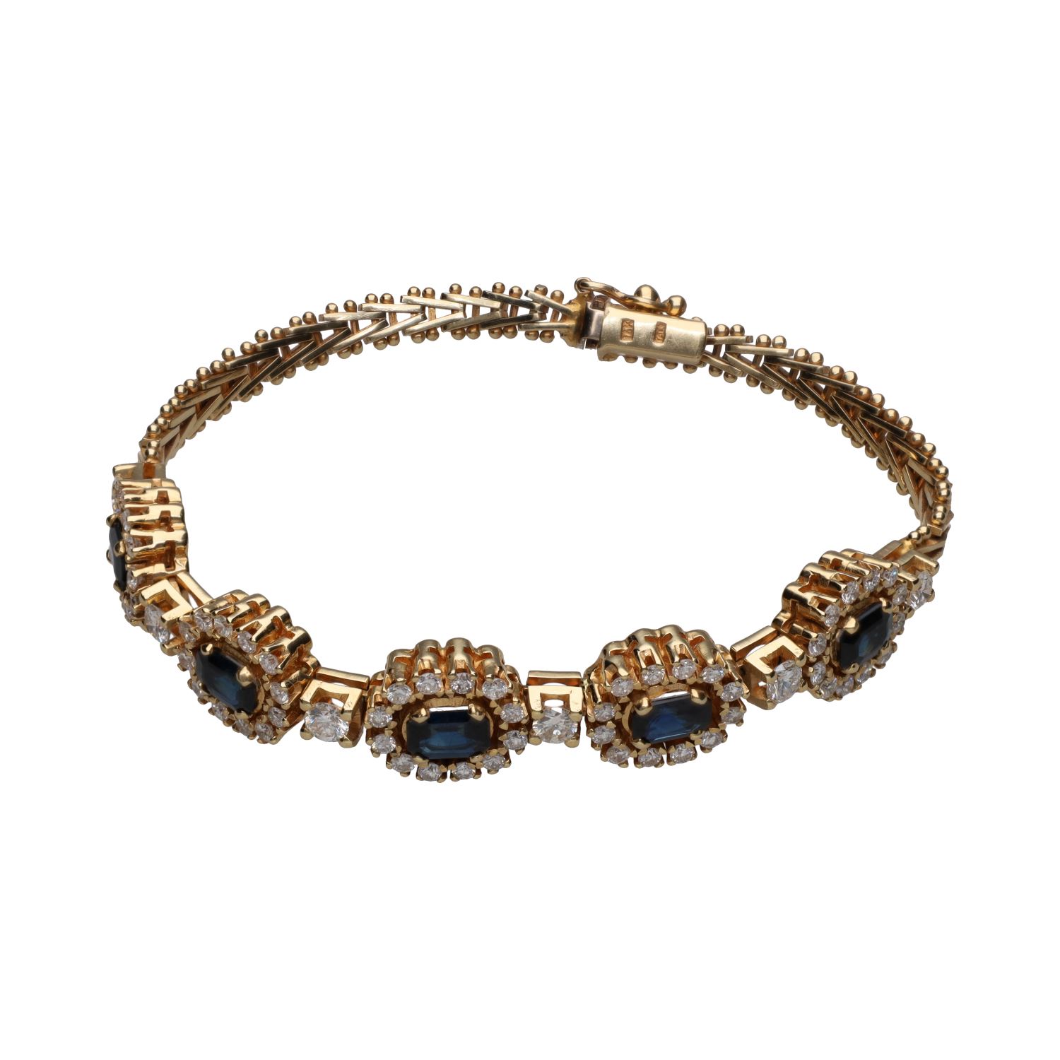Pulsera en oro amarillo de 14k con zafiros y brillantes.