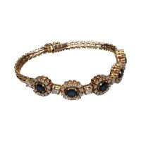 Pulsera en oro amarillo de 14k con zafiros y brillantes.