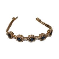 Pulsera en oro amarillo de 14k con zafiros y brillantes.