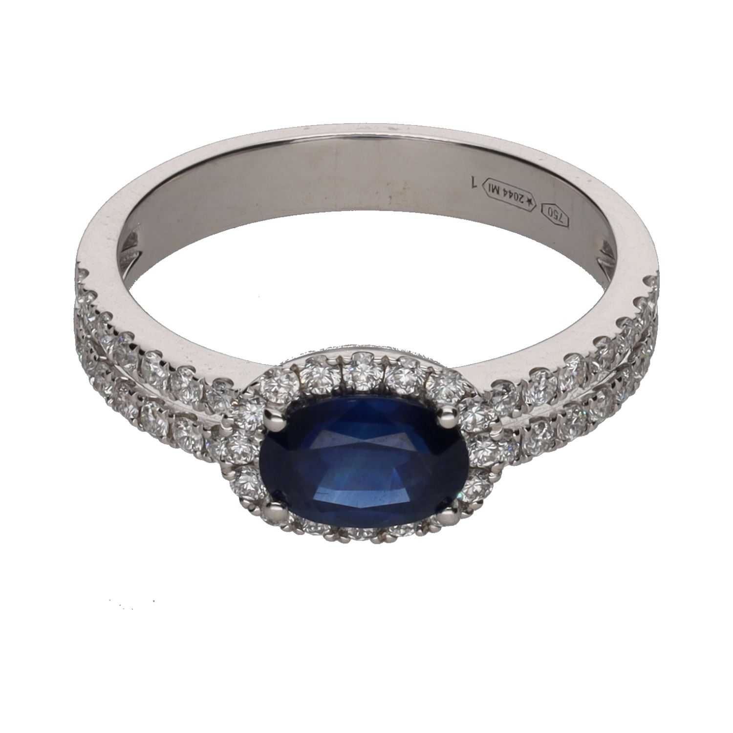 Sortija en oro blanco con un zafiro y brillantes. Talla 14.