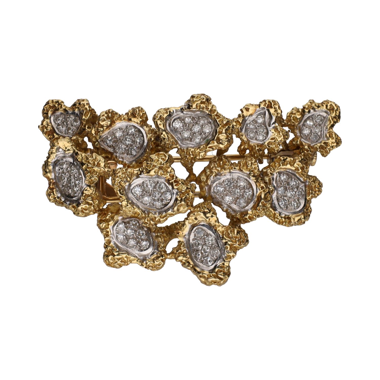 Broche en oro amarillo con cuajados de brillantes.