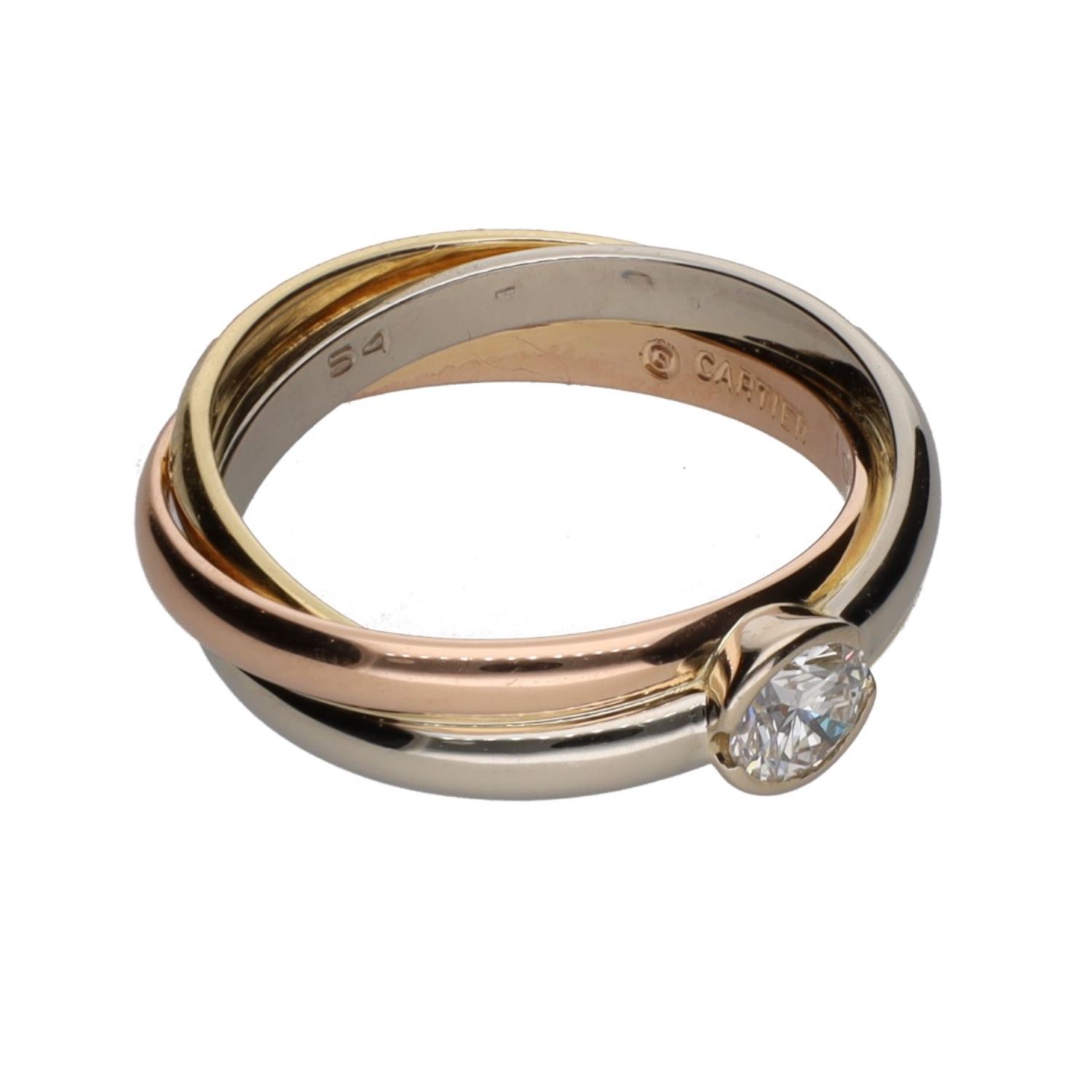 Sortija triana de cartier en tres oros con un brillante. Talla 54