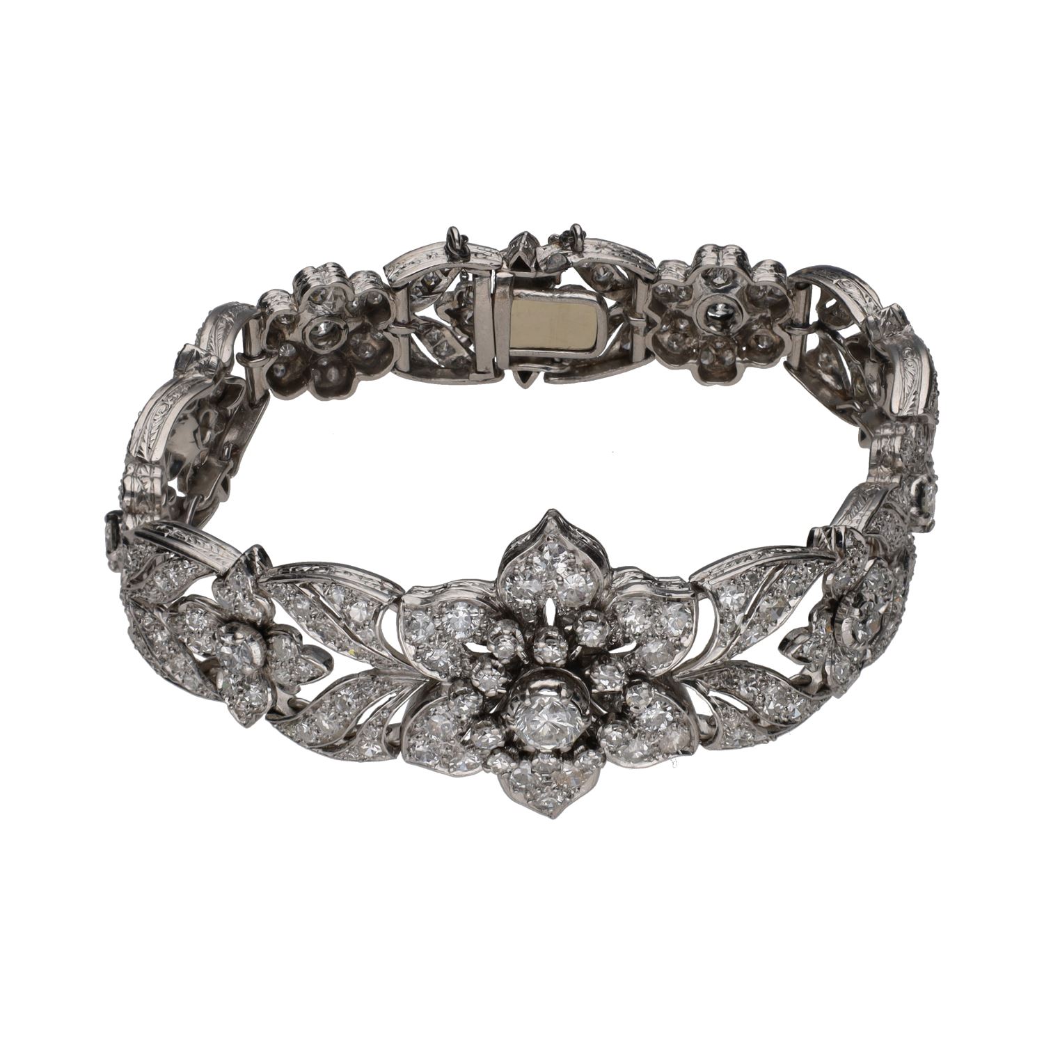 Pulsera antigua en oro blanco con brillantes, flor central.