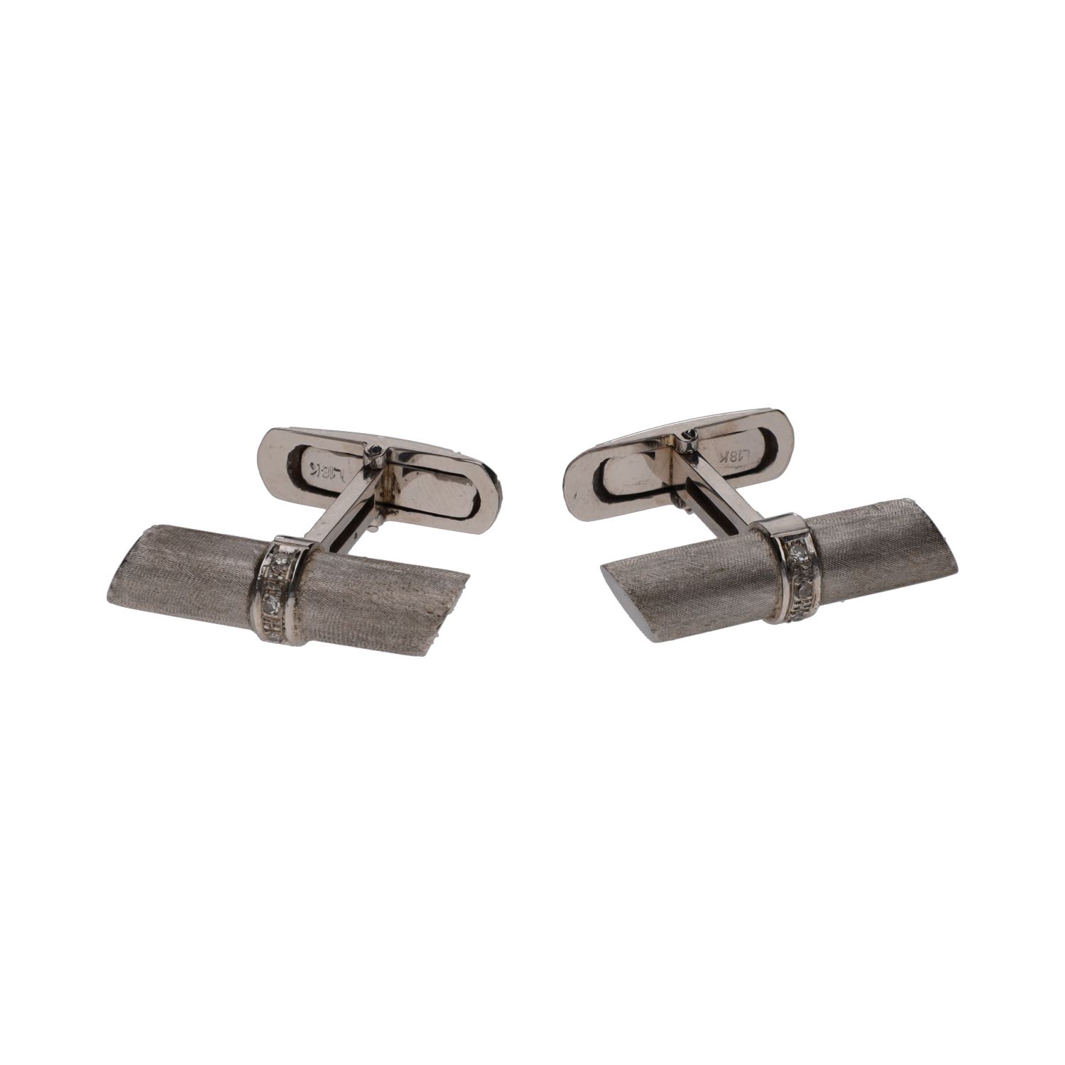 Gemelos en oro blanco con brillantes.