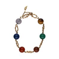 Pulsera en oro amarillo con bolas de piedras de colores.