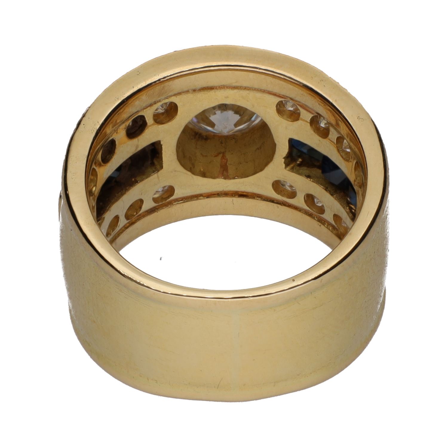 Sortija en oro amarillo con brillante central y detalles con brillantes y zafiros. Talla 12.