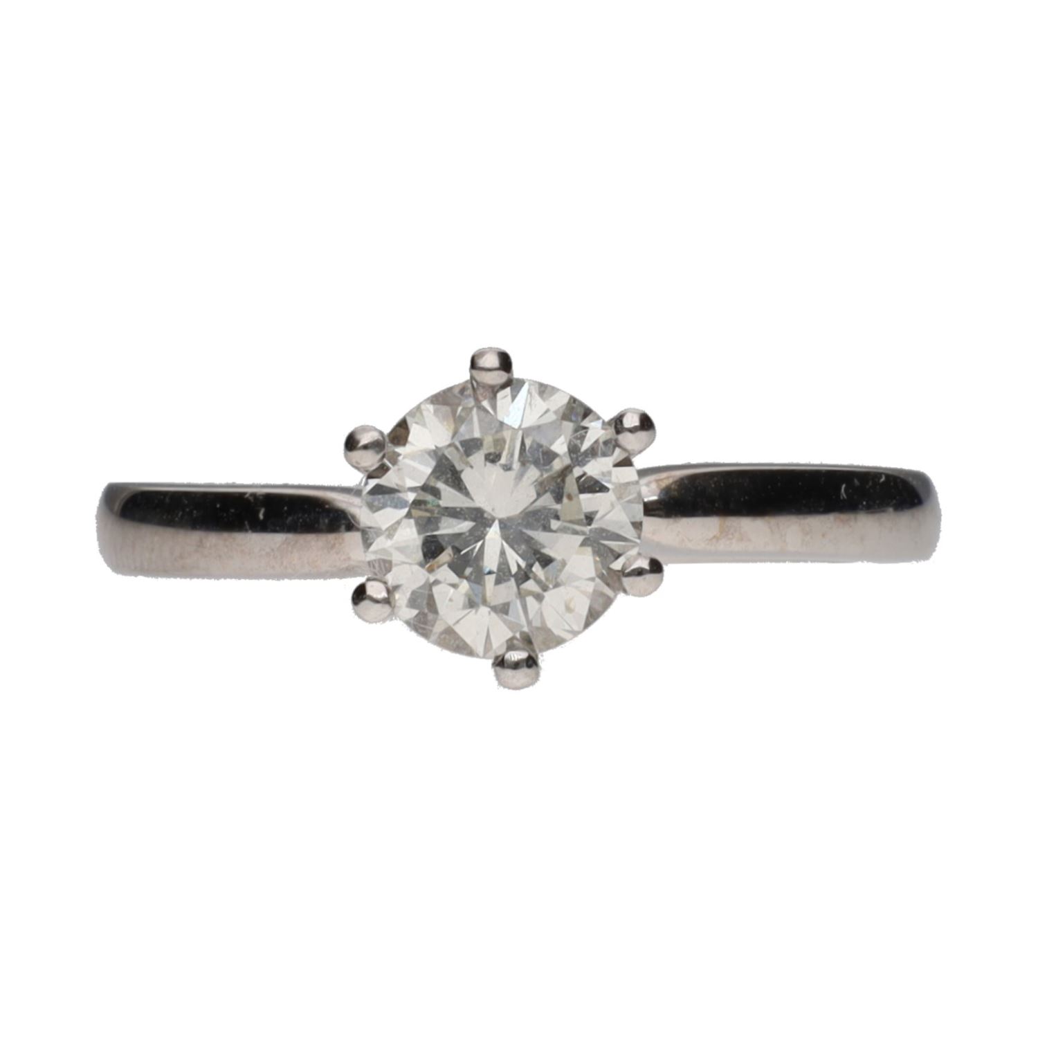 Sortija solitario en oro blanco con un brillante.   Talla 13.