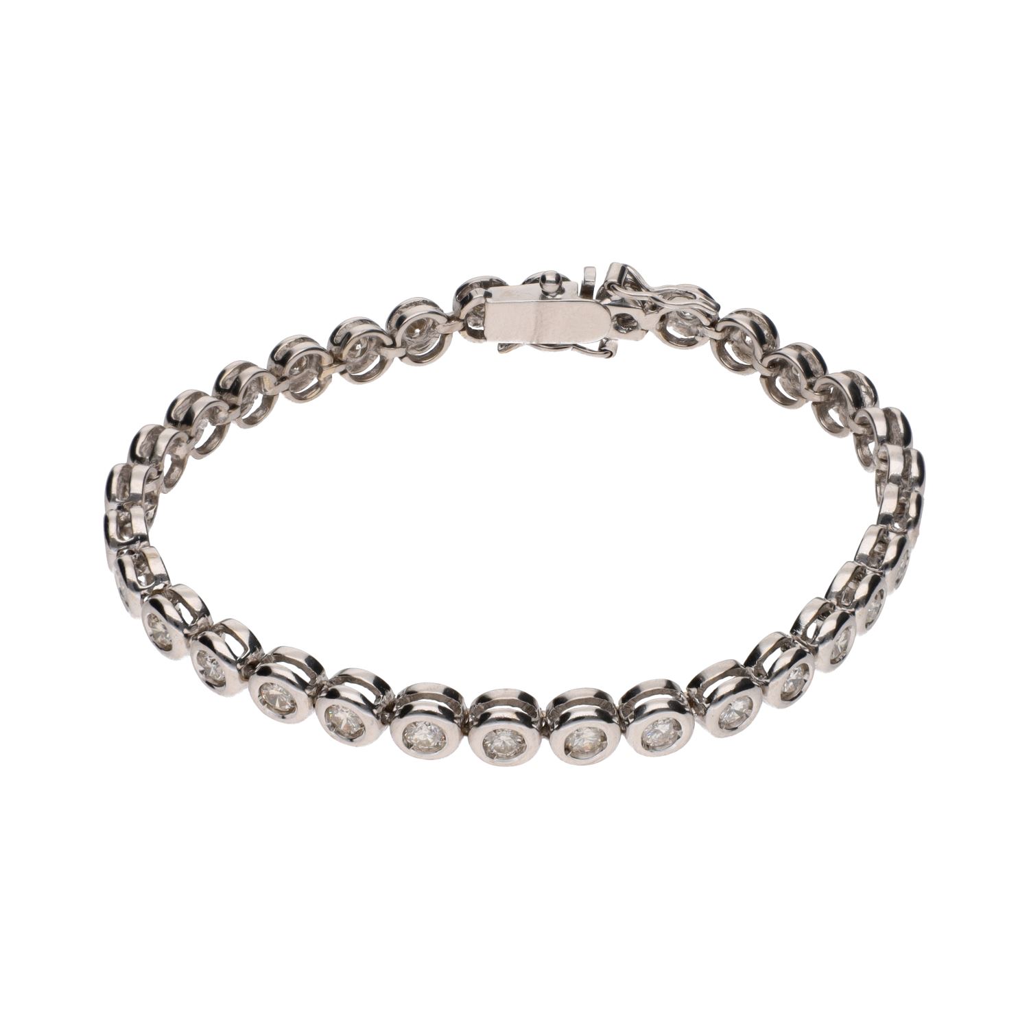 Pulsera riviere en oro blanco con brillantes en chatón.