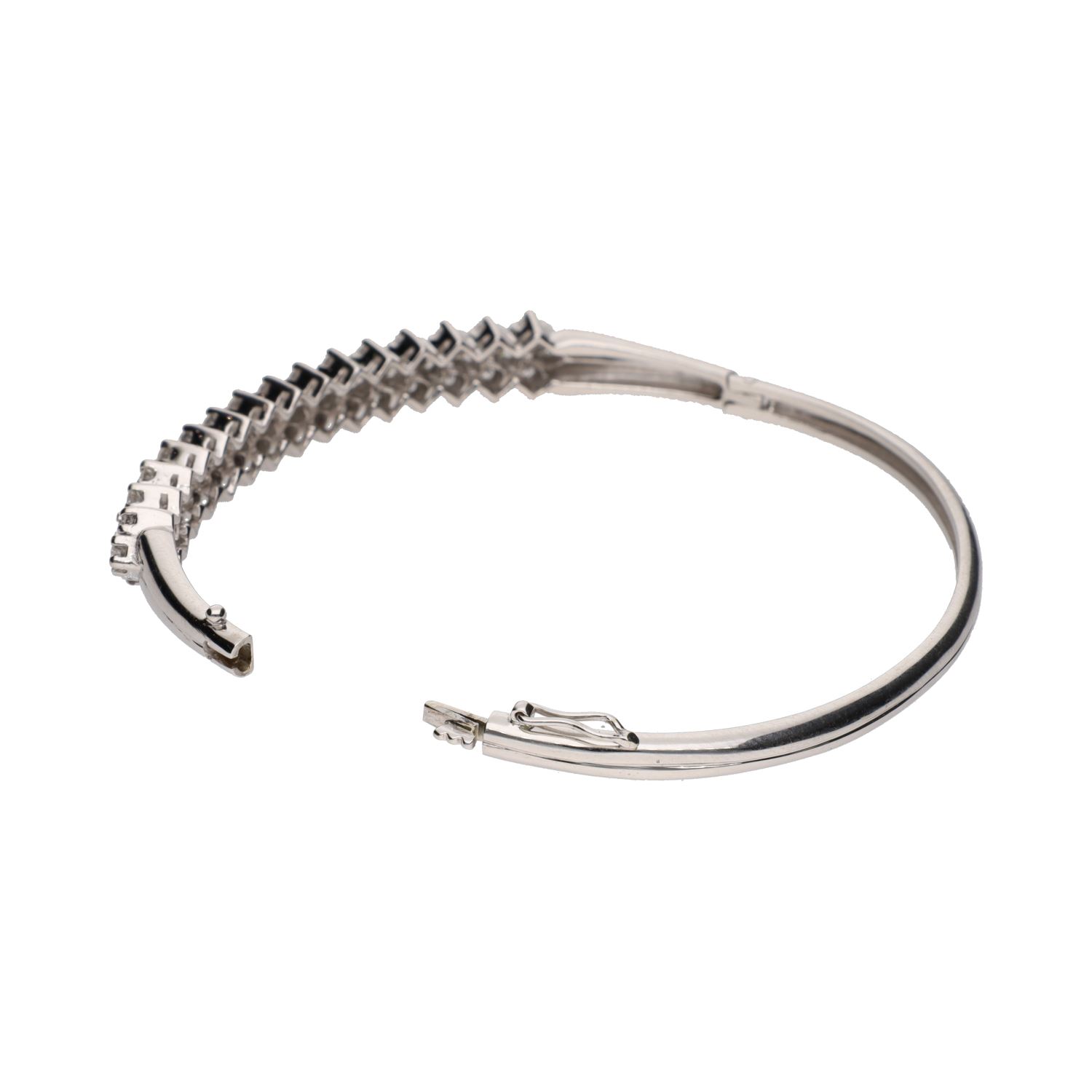 Pulsera rígida en oro blanco con brillantes.