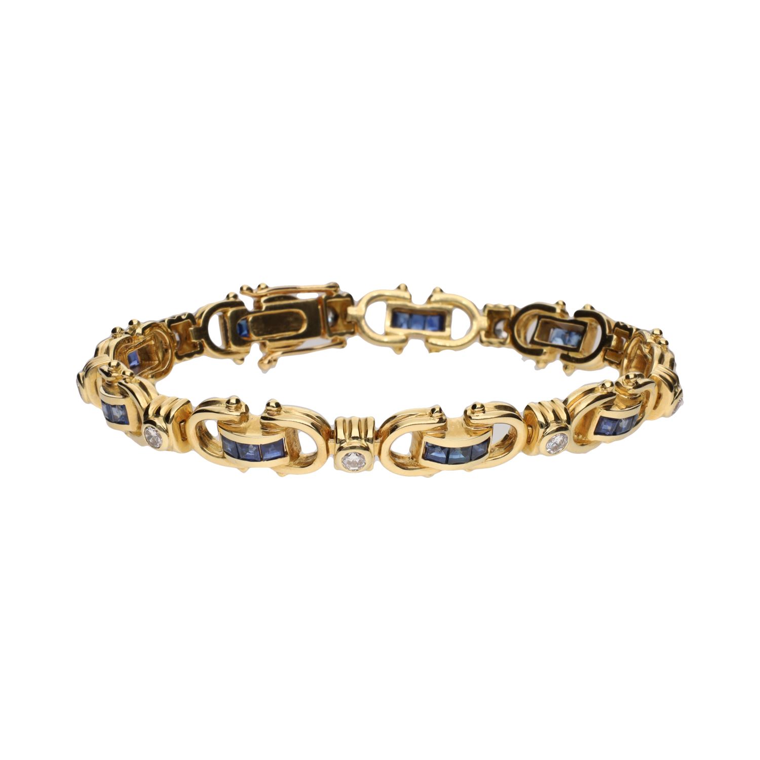 Pulsera en oro amarillo con zafiros y brillantes.