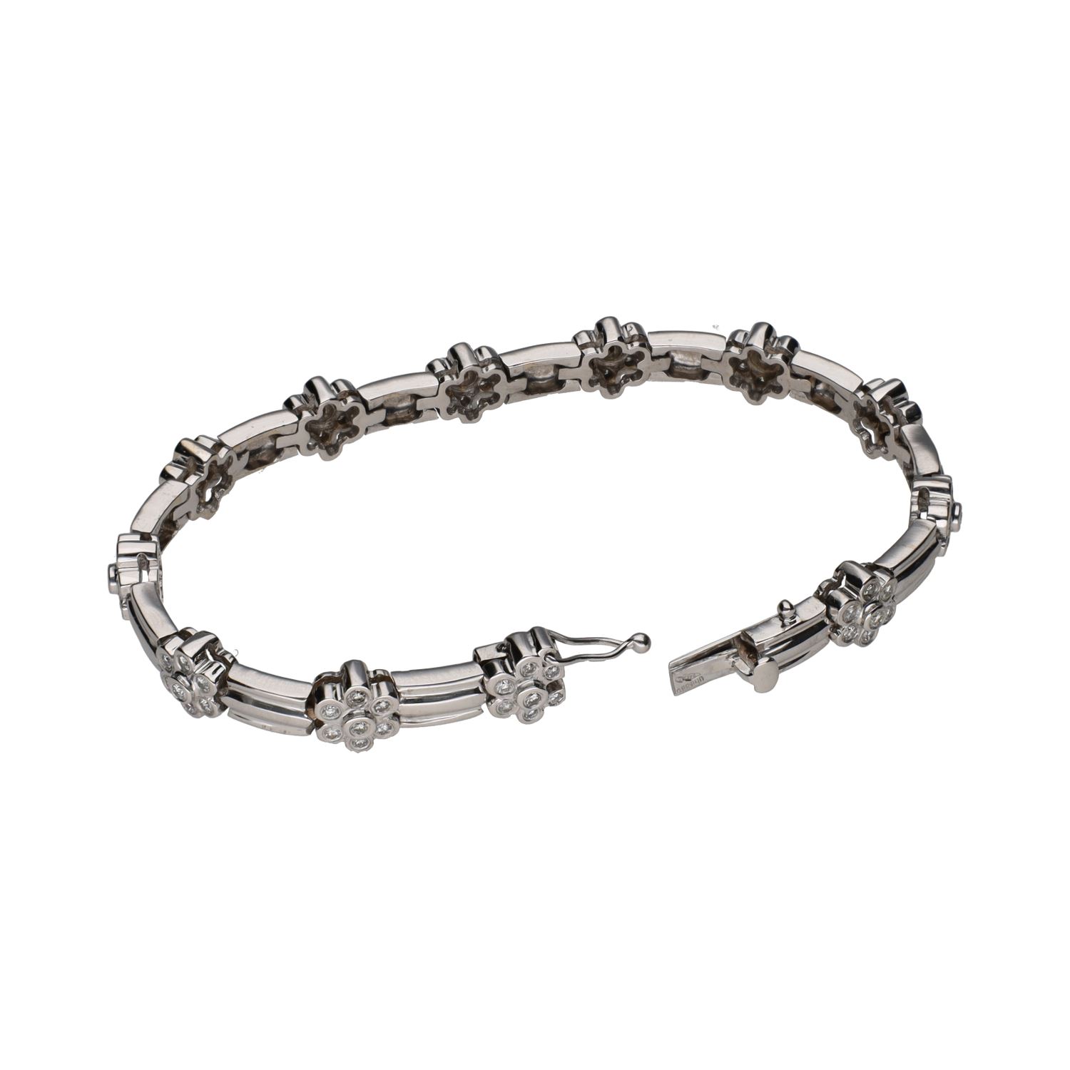 Pulsera en oro blanco con motivos florales en brillantes.