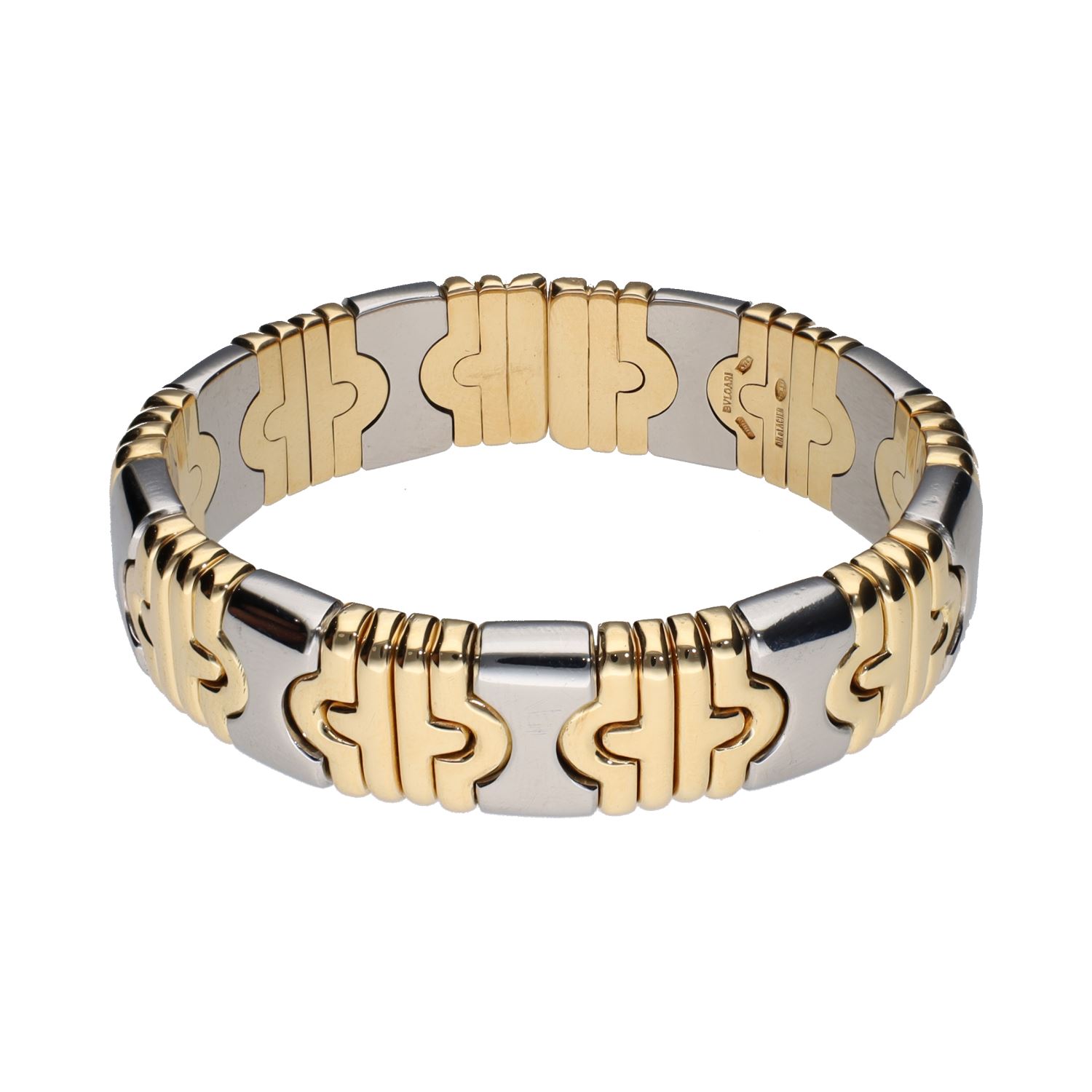 Pulsera abierta parentesis de bulgari en acero y oro.