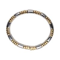 Pulsera abierta parentesis de bulgari en acero y oro.