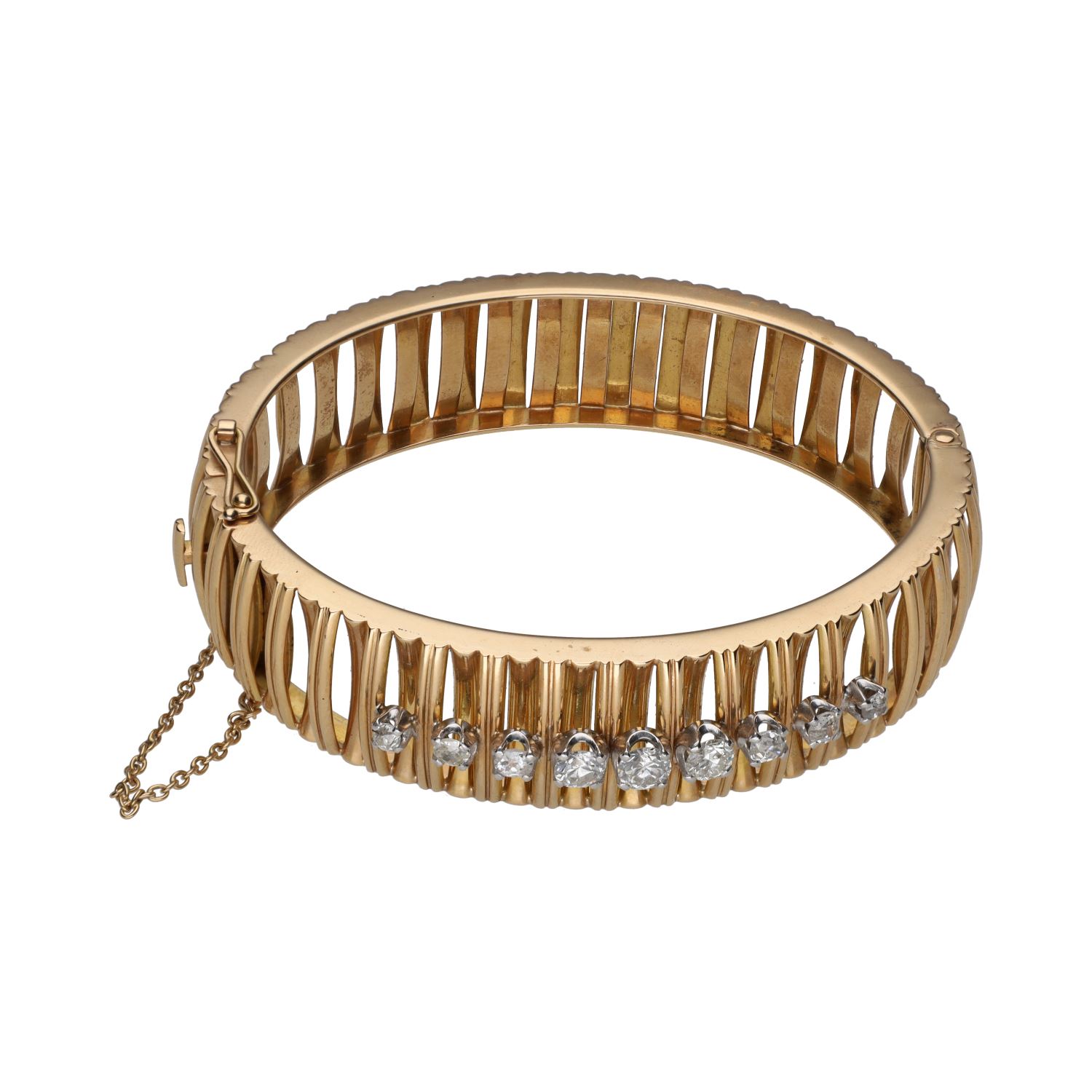 Pulsera rígida ancha en oro amarillo con brillantes.