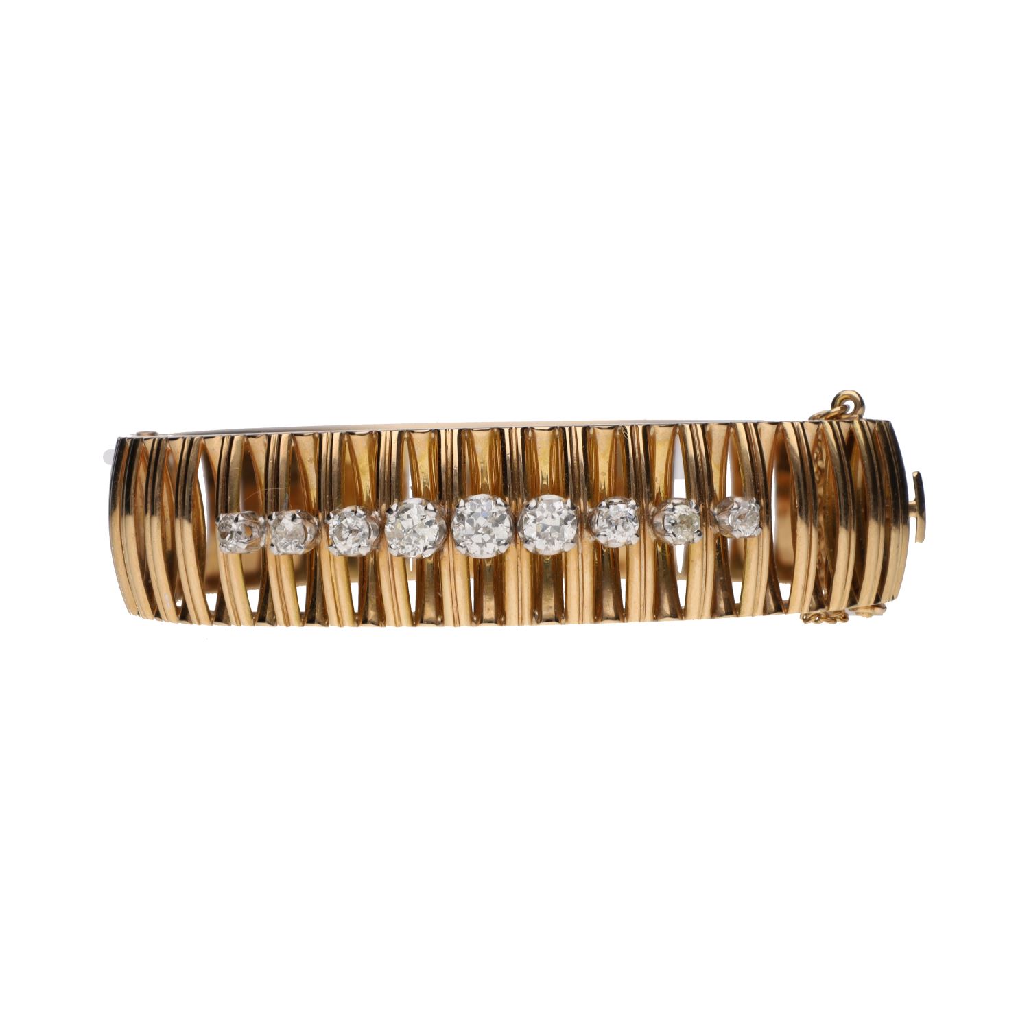 Pulsera rígida ancha en oro amarillo con brillantes.
