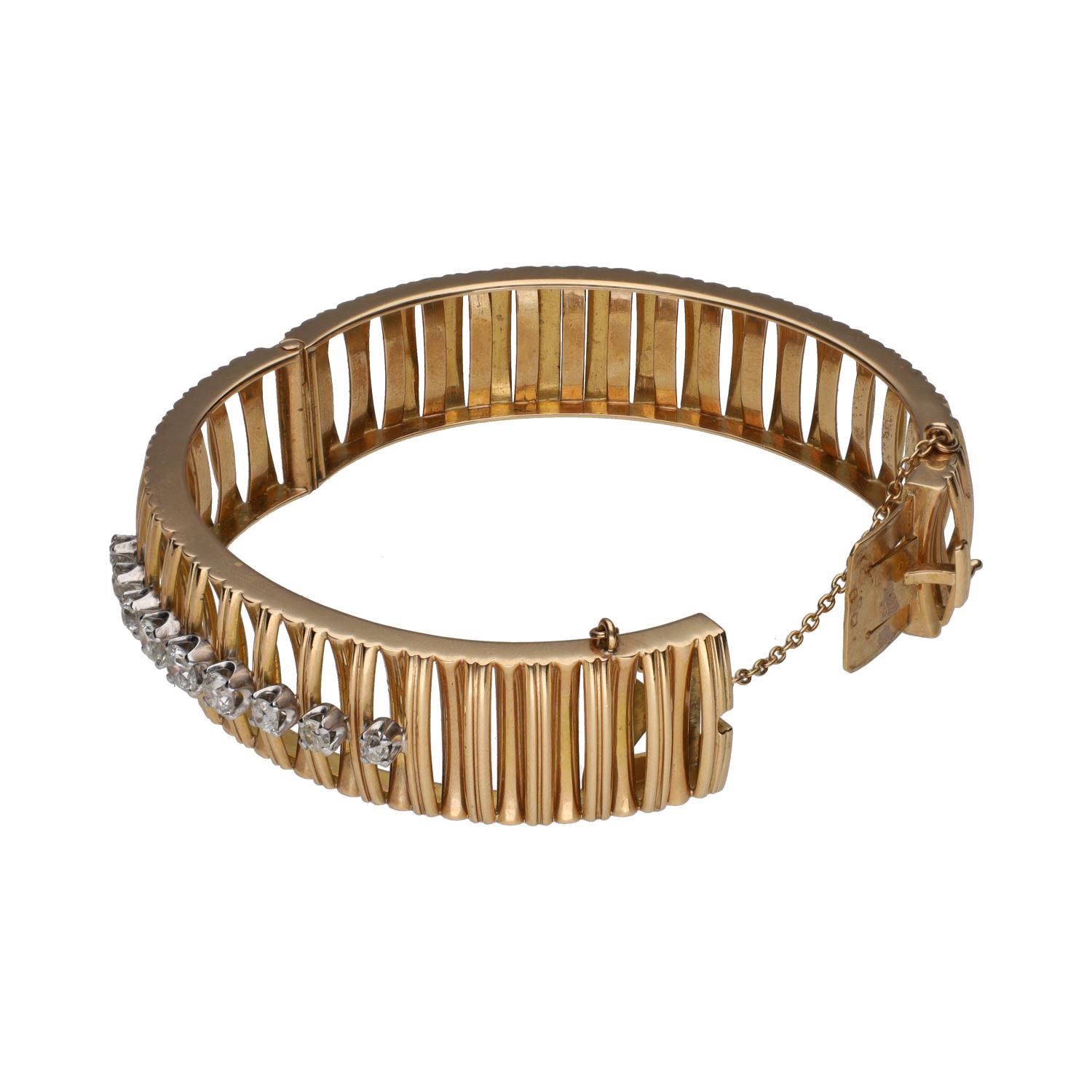 Pulsera rígida ancha en oro amarillo con brillantes.