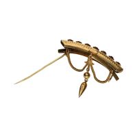 Broche antiguo en oro amarillo con amatistas.