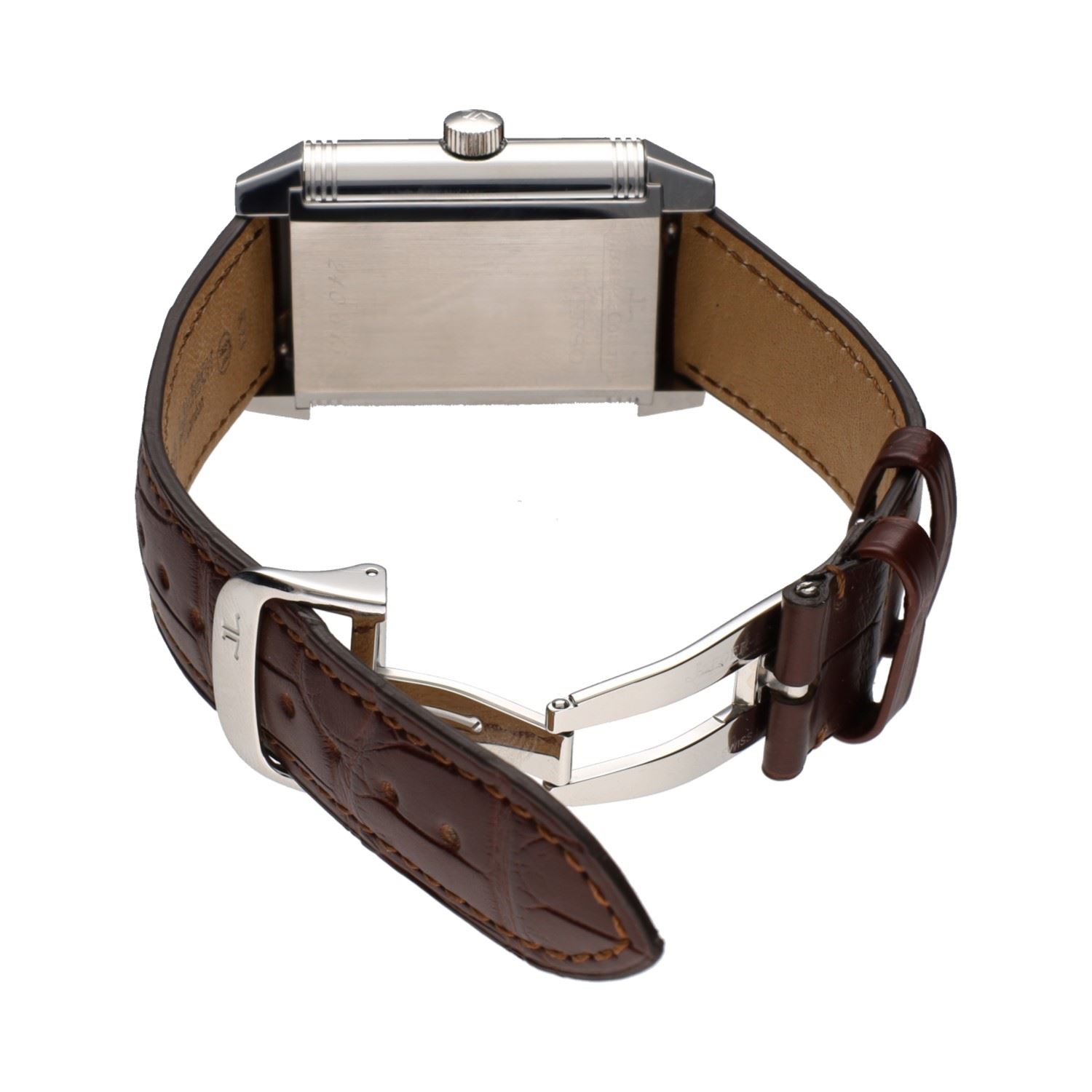 Reverso grande date reserva de marcha acero cuerda manual.  